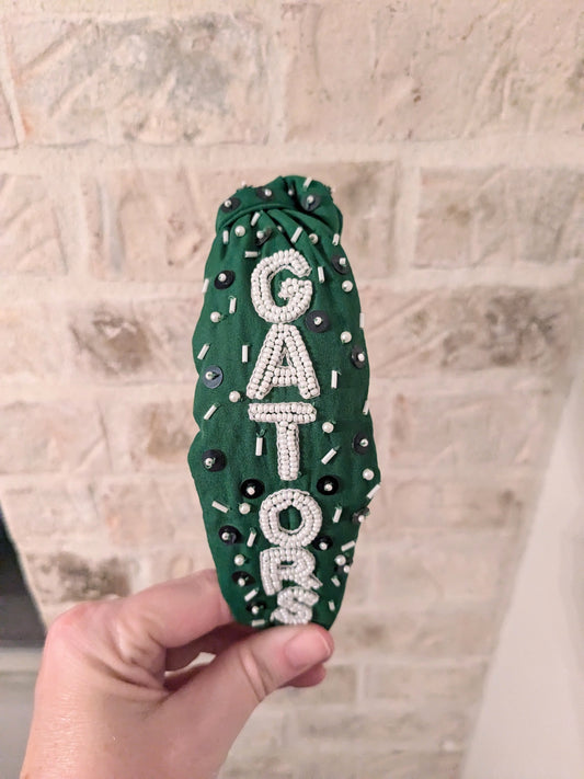 Green beaded headband with Gators lettering