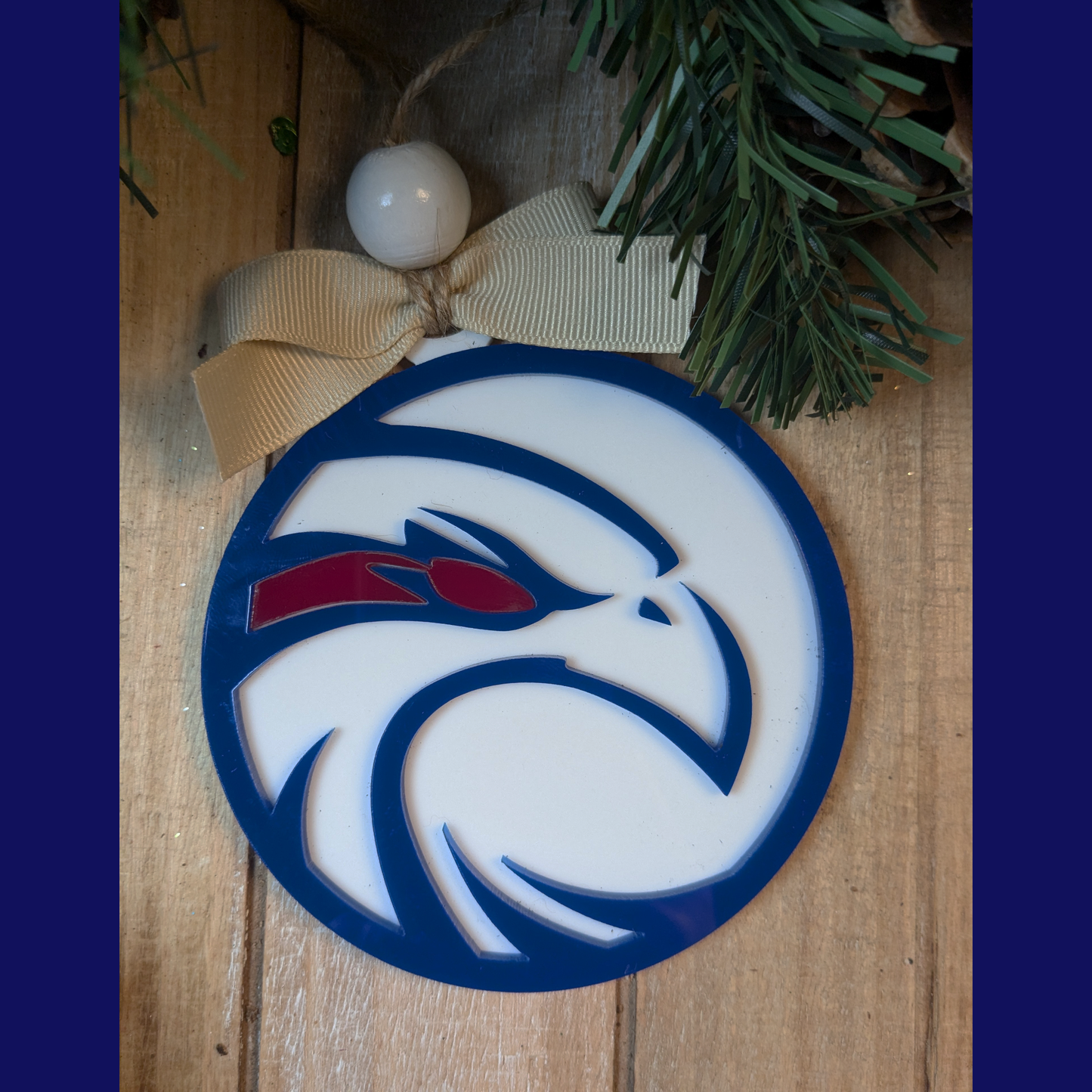 Layered navy and white acrylic ornament with Hannan High School logo