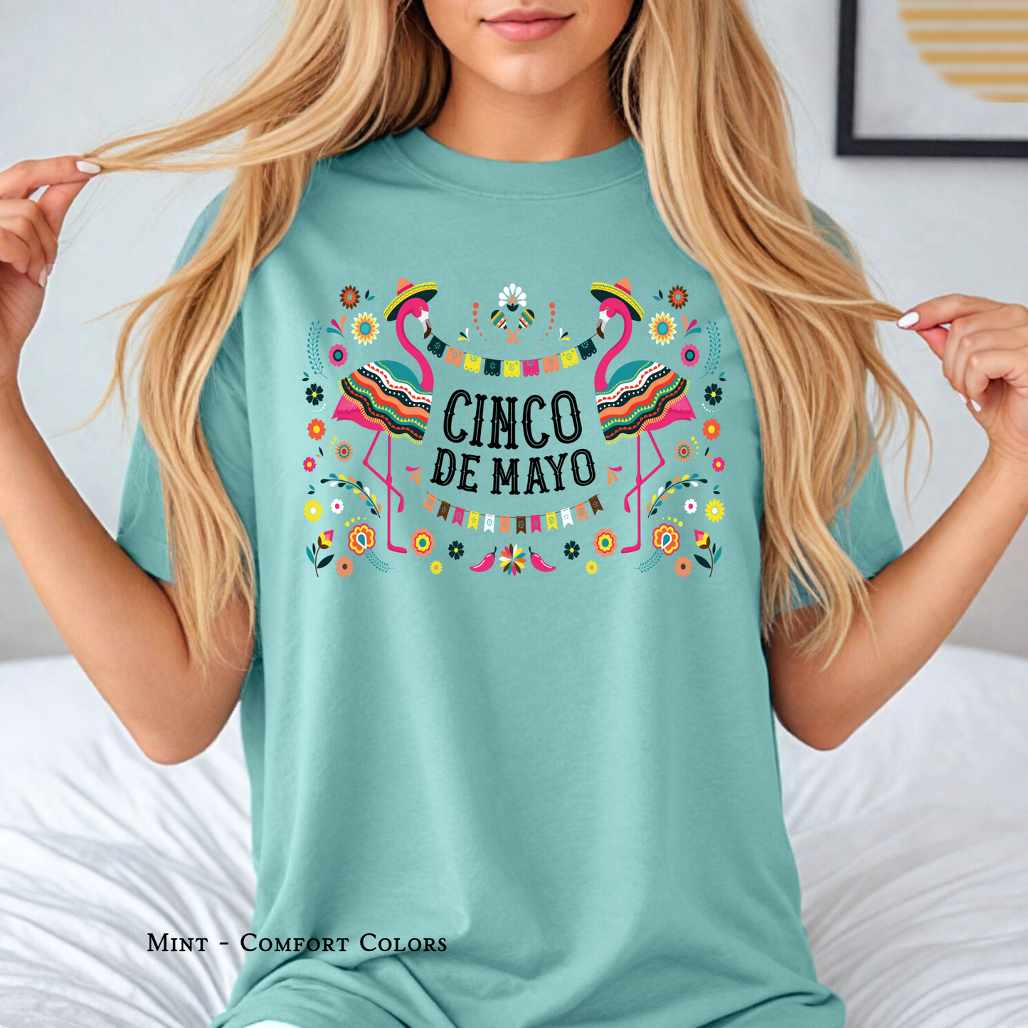 Flamingos Fiesta Tee flat lay with bright colors for Cinco de Mayo