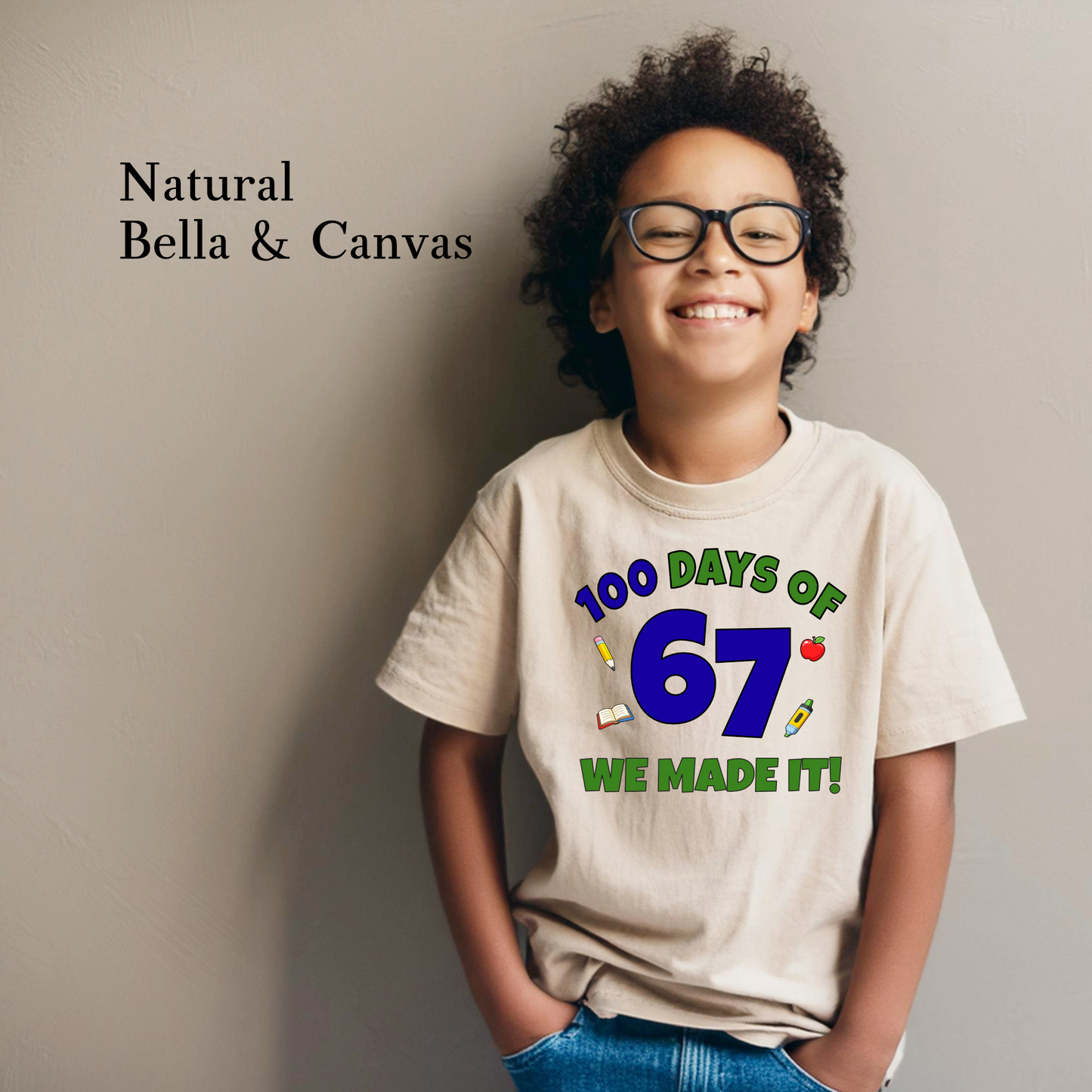 Child wearing a t-shirt with '100 Days of 67 We Made It!' text, standing against a plain background.