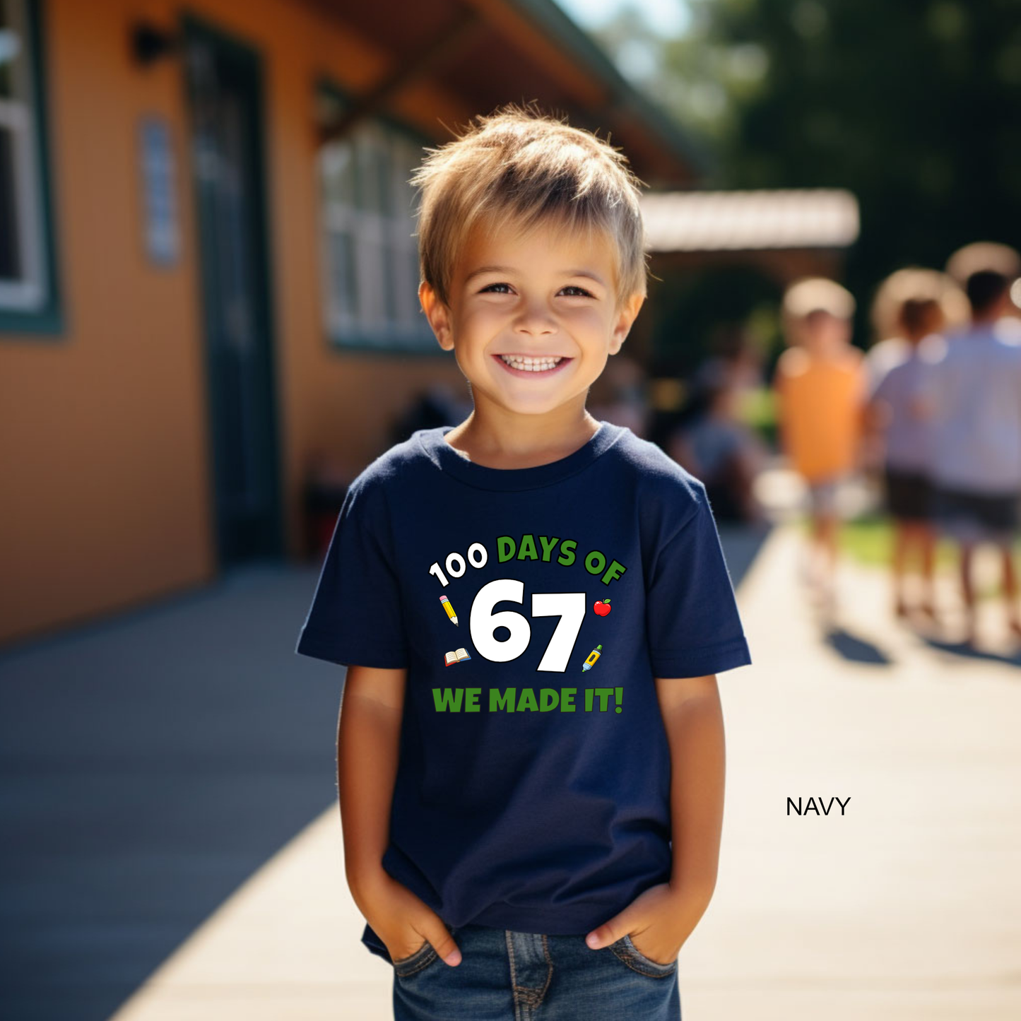 Child wearing a navy blue t-shirt with '100 Days of School' text, standing outdoors.