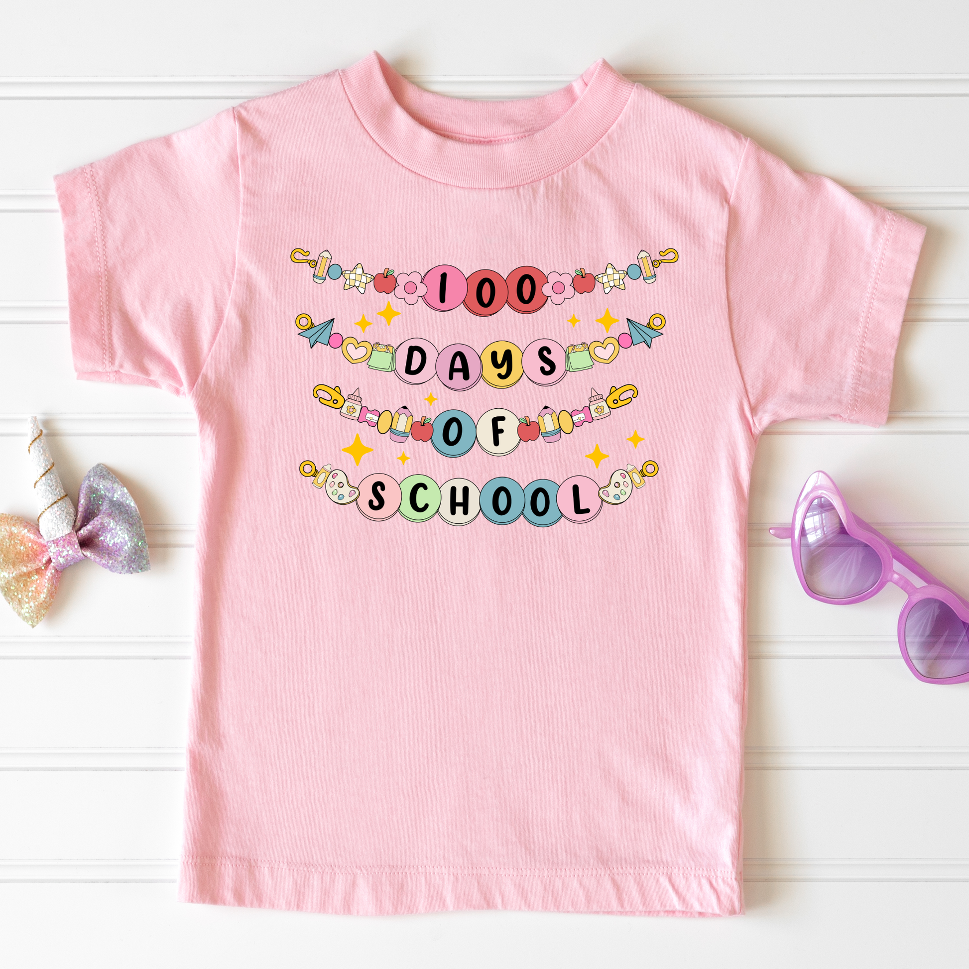 Kids wearing 100 Days of School friendship bracelet shirt