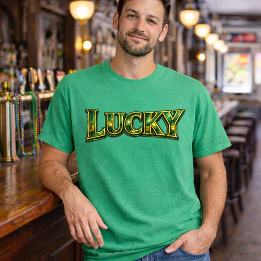 Man wearing a green t-shirt with 'LUCKY' printed on it in a bar setting