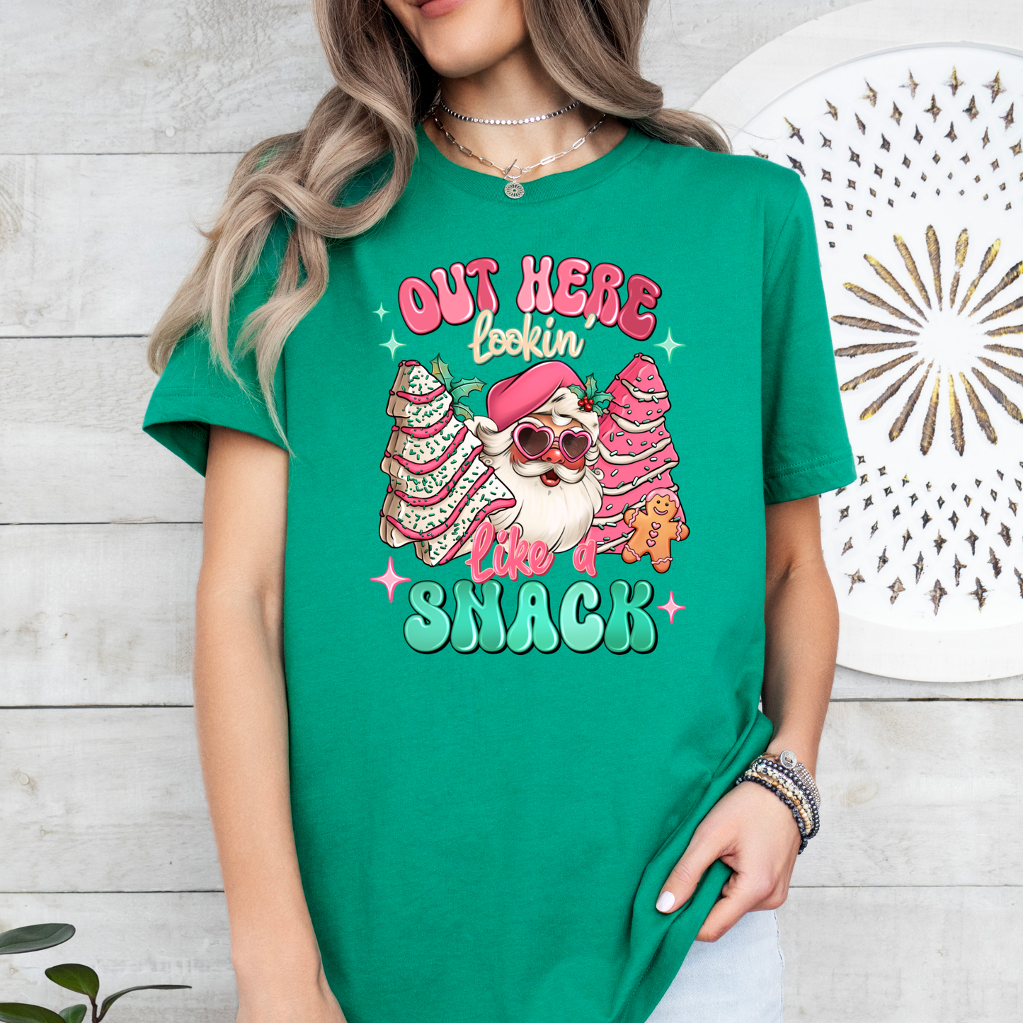 Out Here Looking Like a Snack with Santa and Christmas Cakes on Kelly Green Bella & Canvas Short Sleeve Tee