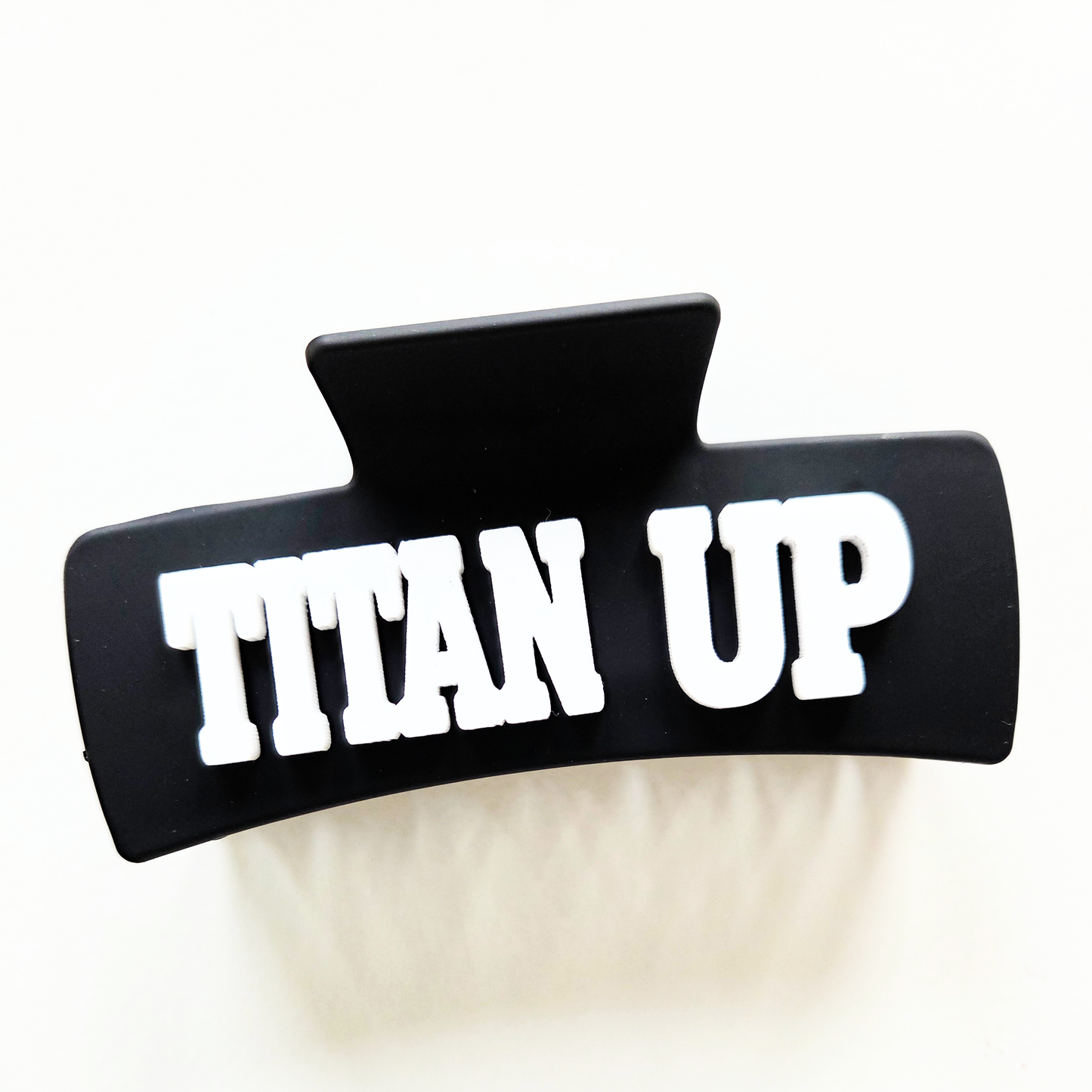 Titan Up white lettering on black claw clip