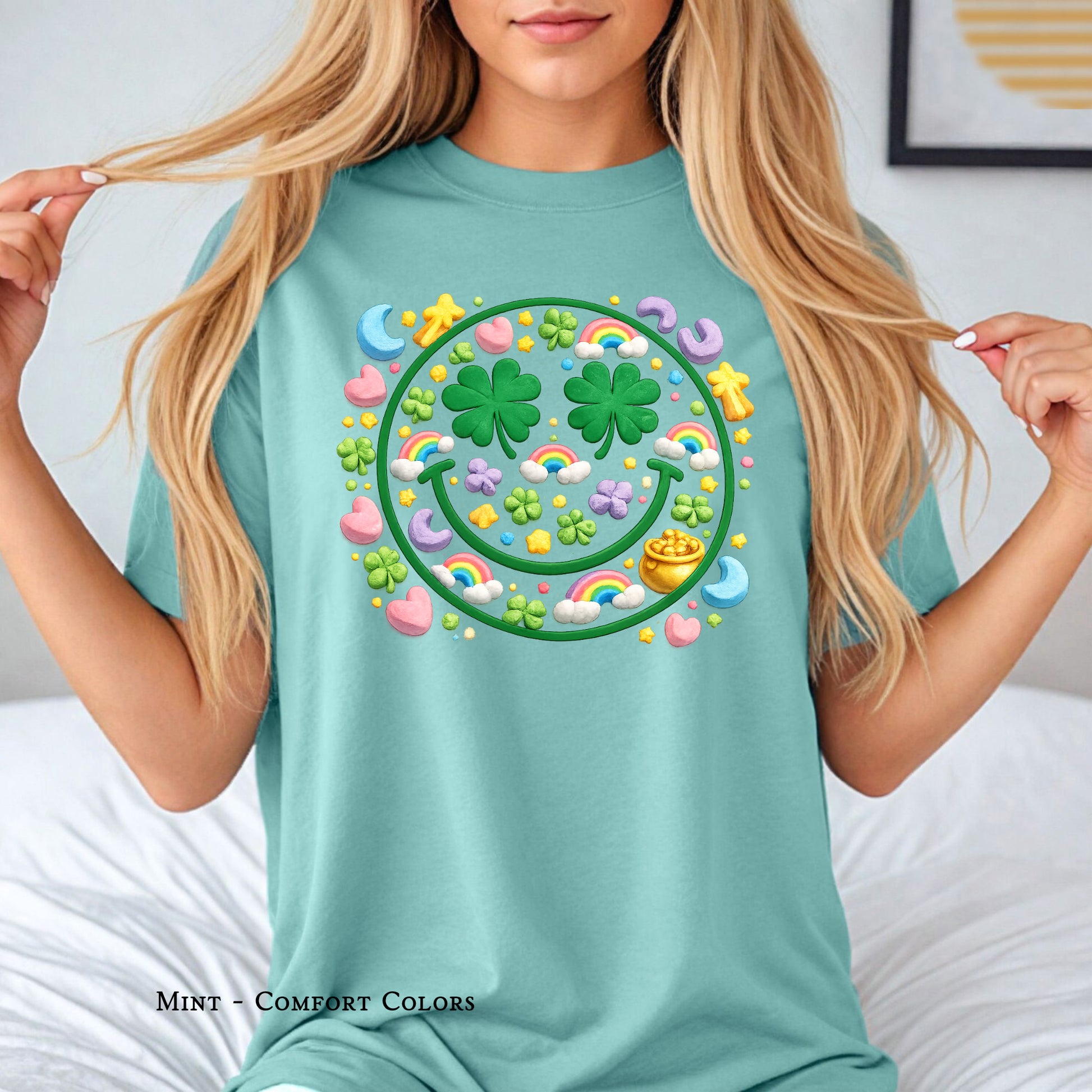 Shamrock smiley face shirt with rainbow and lucky marshmallow icons