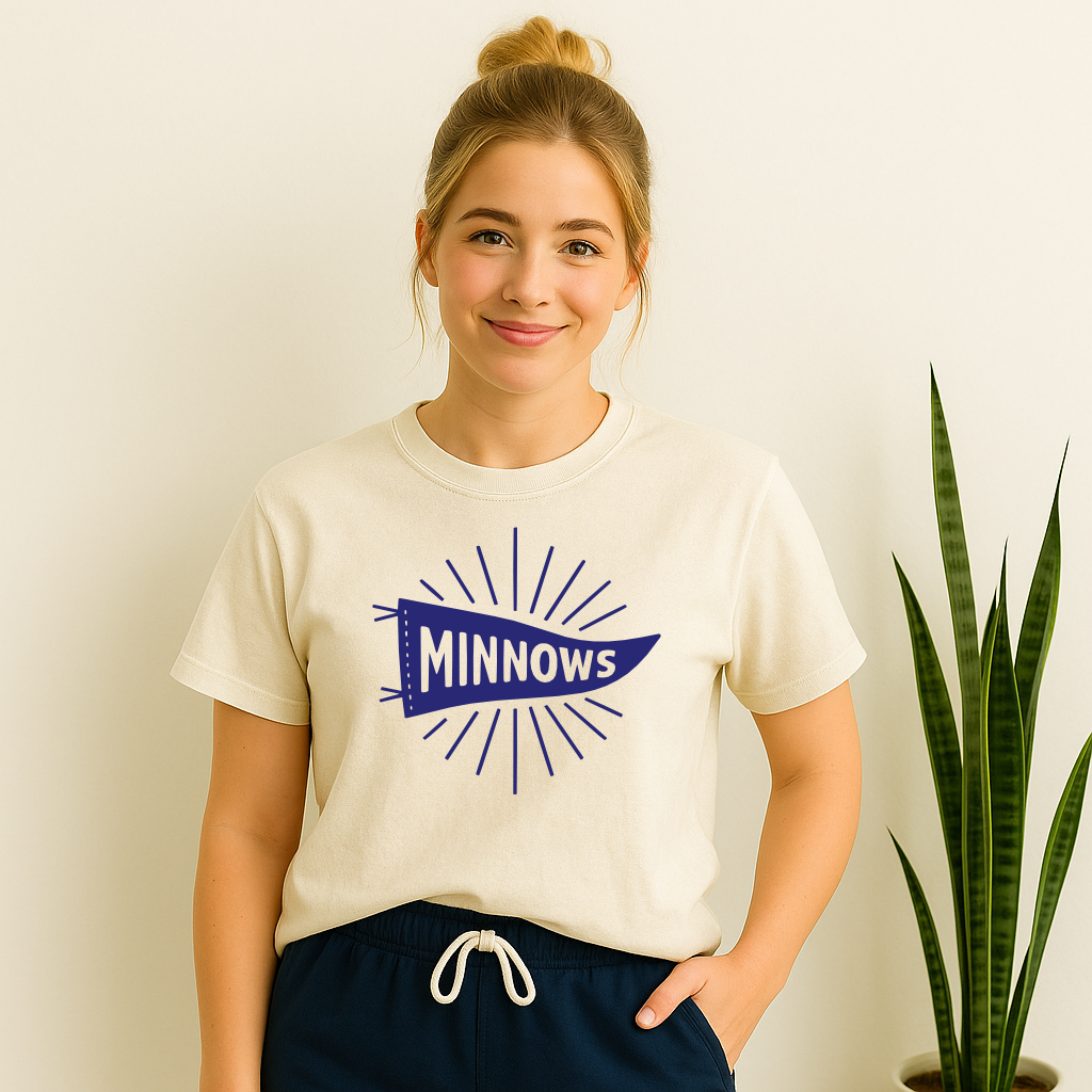 Girl wearing Madisonville Elementary Minnows pennant flag shirt