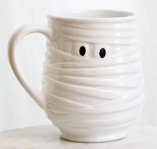 White ceramic mug with a mummy design on a white background