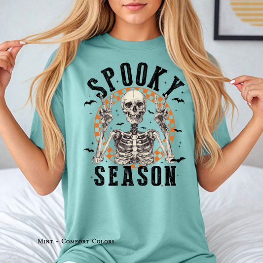 Skeleton peace sign spooky vibes tee by The Twisted Hippo