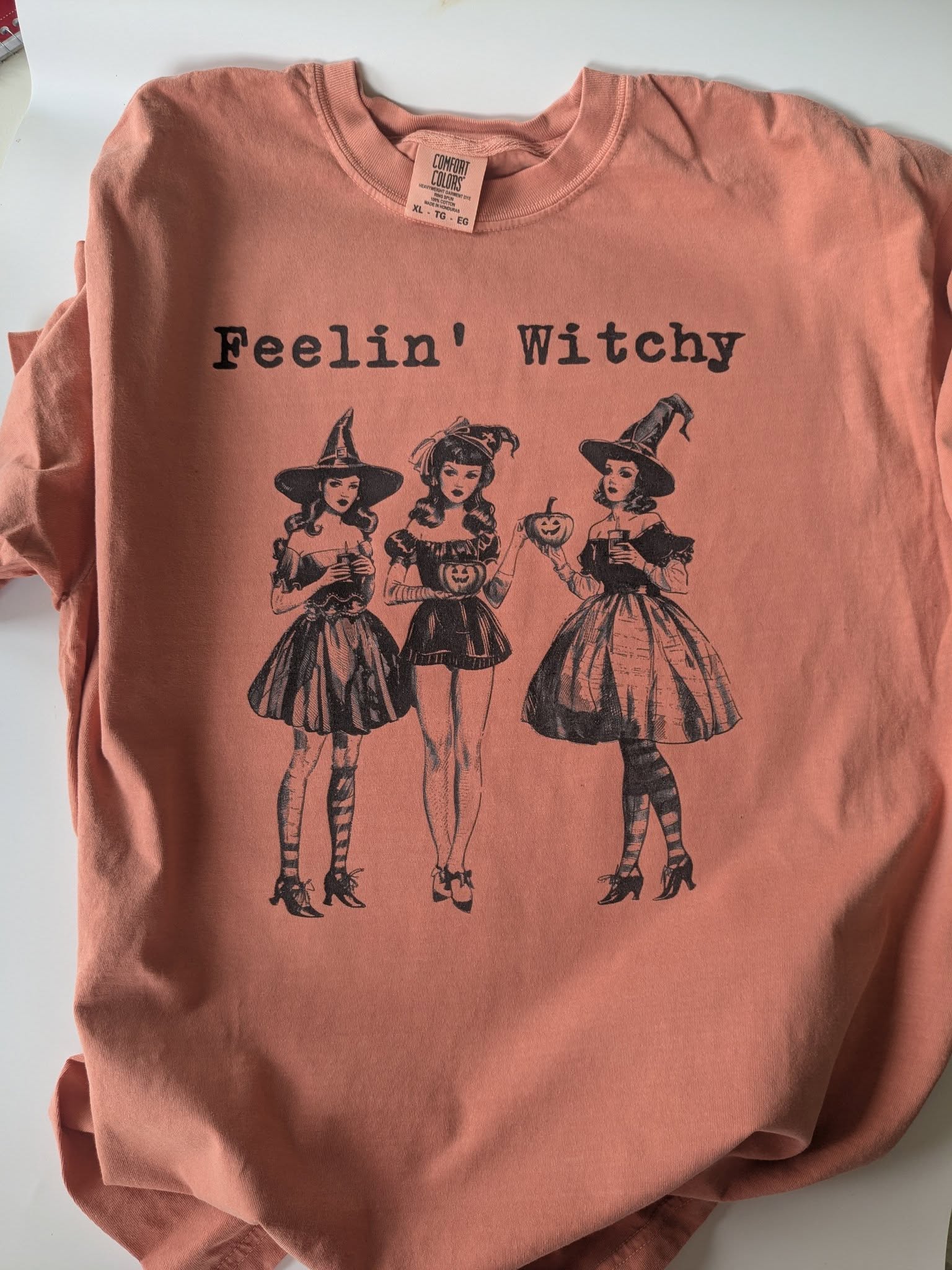 Spooky season Feelin’ Witchy graphic tee flat lay